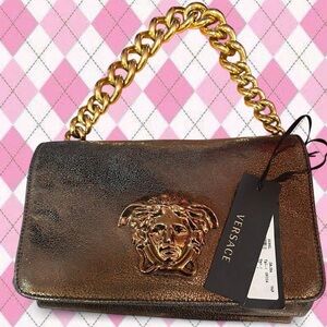 versace gold metallic medusa bag with gold hardware and tags attached